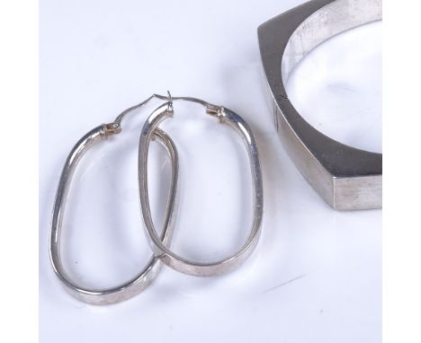 BERNHARD HERTZ - a Danish stylised sterling silver hinged bangle, internal dimensions 60mm x 52mm, and an unnamed pair of ste