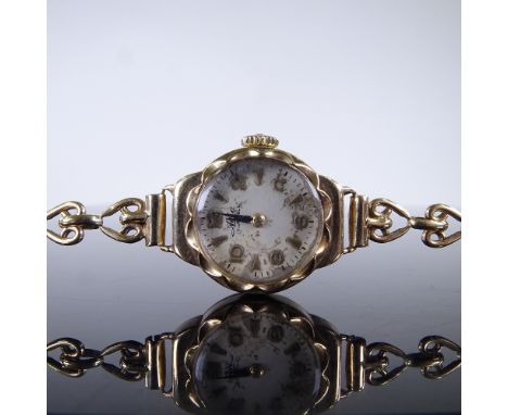 AVIA - A lady's Vintage 9ct gold mechanical wristwatch, silvered dial with gilt eighthly Arabic numerals and 9ct heart link s