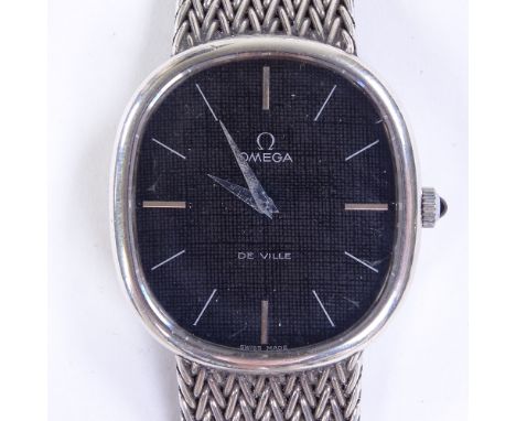 OMEGA - a Vintage sterling silver Deville mechanical wristwatch, black oval dial with baton hour markers and silver woven str
