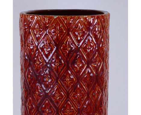 Burmantofts, red treacle glaze relief moulded stick stand, height 60cm, diameter 21cm 
