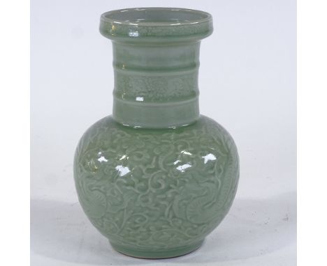 A Chinese celadon glaze porcelain vase, relief moulded dragon design, with seal mark, height 27cm, rim diameter 12.5cmPerfect