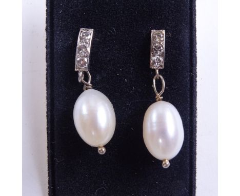 A pair of unmarked gold pearl and diamond drop earrings, total diamond content approx 0.18ct, stud fittings, earring height 2