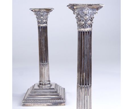 A pair of late Victorian silver Corinthian column table candlesticks, by William Hutton & Sons Ltd, hallmarks London 1900, he