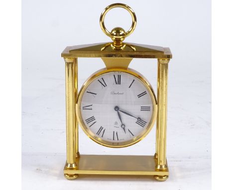 BUCHERER - a Vintage brass-cased 4-pillar 8-day mantel clock, silvered dial with Roman numeral hour markers and 15 jewel move