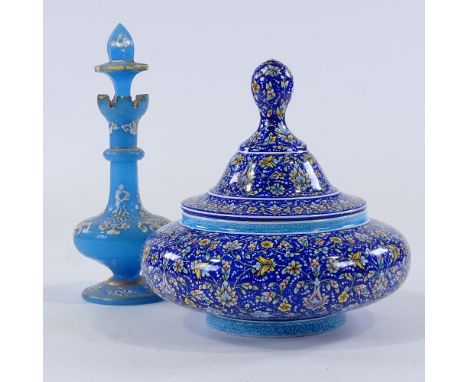 A Persian hand painted enamel bowl and cover, height 20cm, diameter 20cm, and a gilded blue glass perfume bottle and stopper,