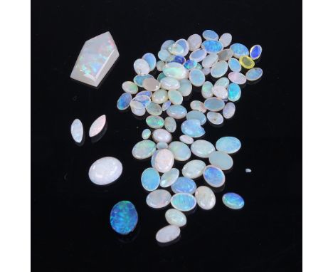 A large quantity of various loose opals, including marquise, cabochons, black opal doublet etcLot sold as seen unless specifi