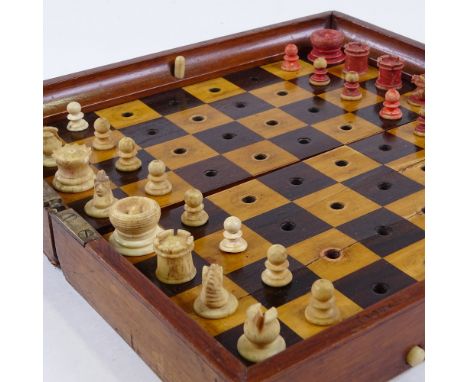 A Jaques of London mahogany travelling chess set, mahogany-cased with rosewood and boxwood board, and carved red and white st