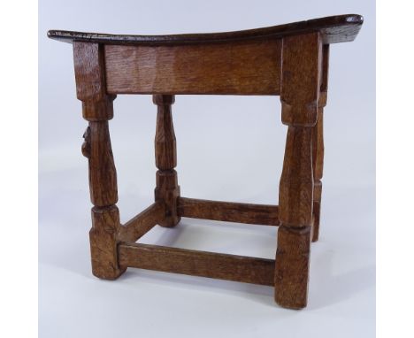 Robert Mouseman Thompson, rectangular oak stool, on octagonal supports with square stretchers, mid-20th century, with slightl