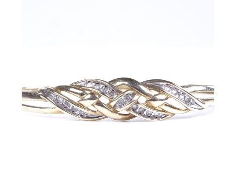A late 20th century unmarked gold diamond crossover hinged bangle, total diamond content approx 0.25ct, band width 9.9mm, int