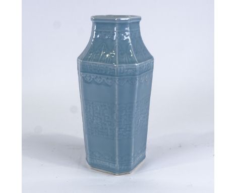 A Chinese blue glaze celadon porcelain square-section vase, with canted corners and relief moulded decoration, impressed seal