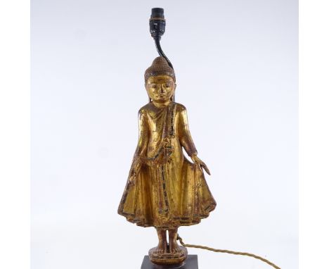 A carved giltwood standing Buddha figural table lamp, height to top of head 49cm, PAT tested 