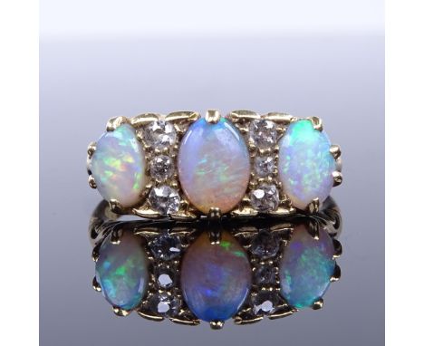 An unmarked high carat gold cabochon opal and diamond half hoop ring, setting height 8.2mm, size N, 5.4gGood overall conditio