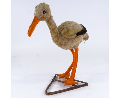 A rare Chiltern Toys stork/crane on original metal stand, 2 original labels, height 40cm 