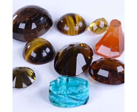 Various loose stones, including carnelian seal, ruby, tigers eye, smoky quartz and scarabLot sold as seen unless specific ite