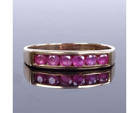 A modern unmarked gold ruby half eternity ring, setting height 3.6mm, size M, 1.9gVery good overall condition, no obvious dam