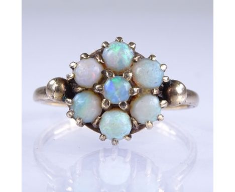 An early 20th century 9ct gold cabochon opal cluster flowerhead dress ring, setting height 12mm, size Q, 2.9gGood overall con