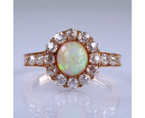 An early 20th century 18ct rose gold cabochon opal and diamond cluster ring, with old-cut diamond shoulders, total diamond co