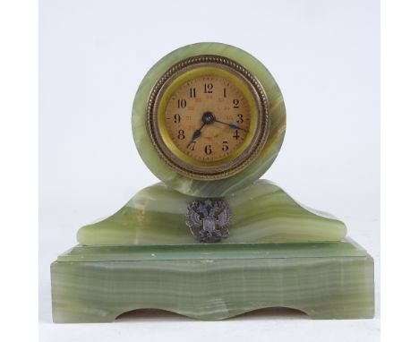 A small Russian green onyx barrel-shaped mantel clock, printed dial with Arabic numerals and applied double eagle plaque, cas