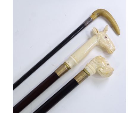 A carved bone dog's head-handled walking stick, a carved bone stag-handled walking stick, and a horn-handled stick (3) 