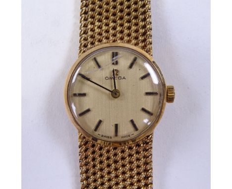 OMEGA - a Vintage lady's 9ct gold mechanical wristwatch, circa 1970s, champagne dial with baton hour markers and 9ct mesh str