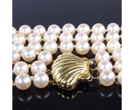 A Vintage triple-strand choker length cultured pearl necklace, on 14ct gold shell clasp, necklace length 13", 62.5gVery good 