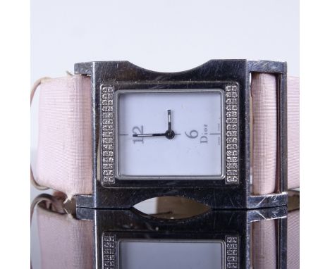 CHRISTIAN DIOR - a lady's Vintage stainless steel quartz wristwatch, ref. DV3036, white dial with halfly Arabic numerals and 