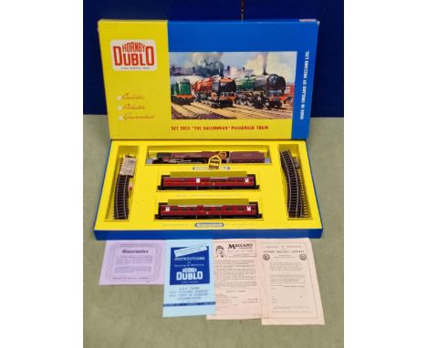 A boxed Hornby Dublo 2023 Caledonian Passenger Set, M, showing no signs of use. Box base superb with correct rings, lid has h