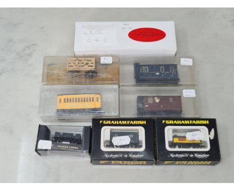 A boxed Union Mills N gauge LNER 0-8-0 Locomotive, three boxed Graham Farish Wagons and four boxed Egger-Bahn 009 Coaches and