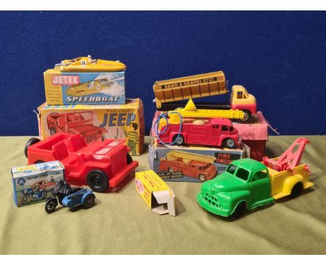 A boxed Brimtoy clockwork Tipper Lorry (box lid A/F), a boxed Jetex Speedboat, boxed Mettoy Fire Engine, boxed Flexible Polyt