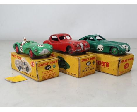 Three boxed Dinky Toys including No.110 green Aston Martin DB3 Sports, No.157 red Jaguar EX120 Coupe (in box with white spot)