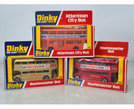 Two boxed Dinky Toys No.289 Routemaster 'Esso' Buses, one gold and one red, a boxed No.291 'Kenning' Atlantean Bus, a No.293 