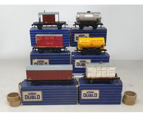 Six boxed Hornby Dublo 2-rail BR Wagons with BR over stickers including LWB Ventilated, Low-sided Furniture, Shell Tanker, Lo