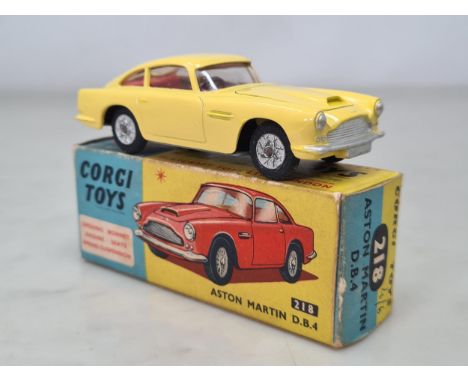 A boxed Corgi Toys No.218 yellow Aston Martin D.B.4, M, box Ex plus