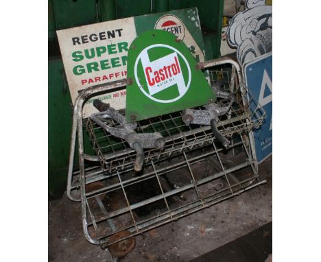 A Castrol oil can fore court display trolley, two pump handles with additive attachments and two enamel and tin Paraffin sign