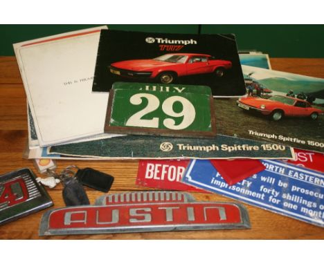 Triumph Spitfire 1500 sales brochure, a TR7 example, a VW example, other literature and an enamel calendar.