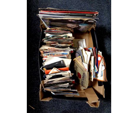A box containing vinyl 7 and 12 inch singles to include Dead or Alive, Michael Jackson, The Shadows etc 