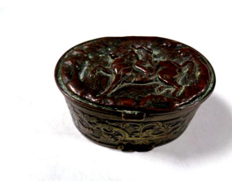 An antique embossed plated snuff box depicting figure on horseback   