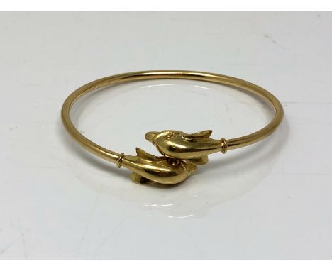A 14ct gold dolphin bangle CONDITION REPORT: 7.5g. 