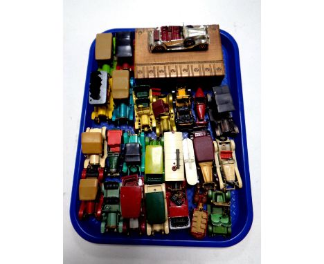 A tray containing die cast vehicles by Lesney and Matchbox classic cars together with a wooden trinket box surmounted by a ca