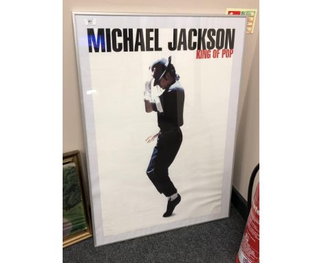 A framed poster : Michael Jackson King of Pop, 70 x 101 cm 
