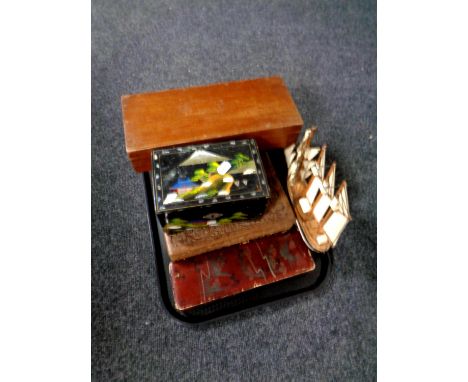A tray of assorted trinket boxes together with a wooden model of a ship 