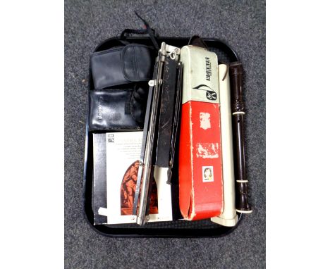 A tray containing cameras, music stand, Hohner melodica, recorder etc  