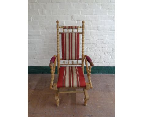 A blonde oak bobbin American style rocking chair  