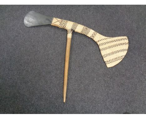 A New Guinea Western Highlands ceremonial stone axe with wicker work, 20th century (a/f) CONDITION REPORT: Blade broken and r