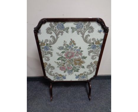 An antique mahogany and tapestry fire screen/table  