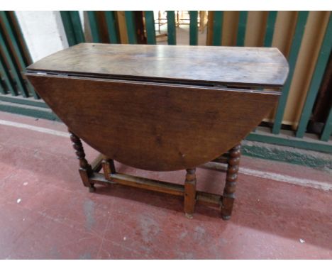 A 19th century oak gate leg table