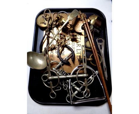 A tray of miscellaneous to include horse bits, stirrups, plated ladle, pair of miniature axes, Gilbert pocket sundial, copper