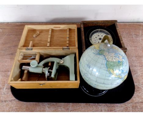A tray of boxed student microscope, Plastimo French compass in box, miniature tin plate globe 