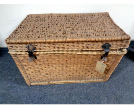 An early 20th century wicker hamper 
