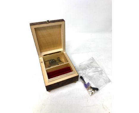 A 9ct gold pendant, 4 grams, together with two 9ct gold crucifix pendants, 2.9 grams, two pairs of yellow metal mounted earri